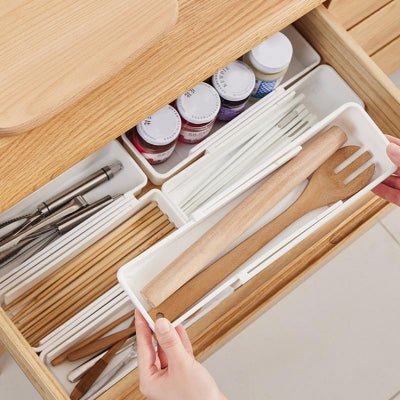 ranges couverts télescopique blanc ingénieux optimise l'espace sans compris sur le style